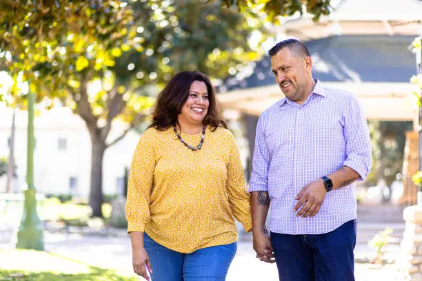 Photo of Millenial Hispanic Married Couple in Park