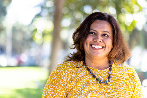 Portrait of a beautiful Mexican Woman Portrait of a beautiful Mexican Woman at a park pudgy woman pictures stock pictures, royalty-free photos & images