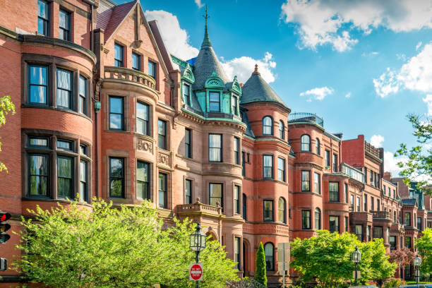 Typical Townhouses Back Bay Boston Massachusetts Typical brownstone townhouses in Back Bay district of downtown Boston, Massachusetts, USA on a sunny day. row house photos stock pictures, royalty-free photos & images
