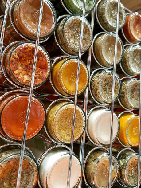 Spice Rack Back Close-up photo of a spice rack with various spices. spice rack stock pictures, royalty-free photos & images