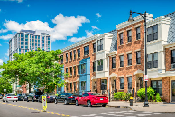 Townhouses East Boston Massachusetts Cars are parked in front of townhouses in East Boston Massachusetts USA on a sunny day. east boston stock pictures, royalty-free photos & images