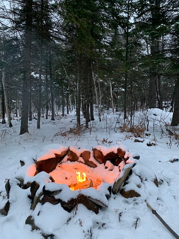 Campfire in the winter forest lakeside winter like