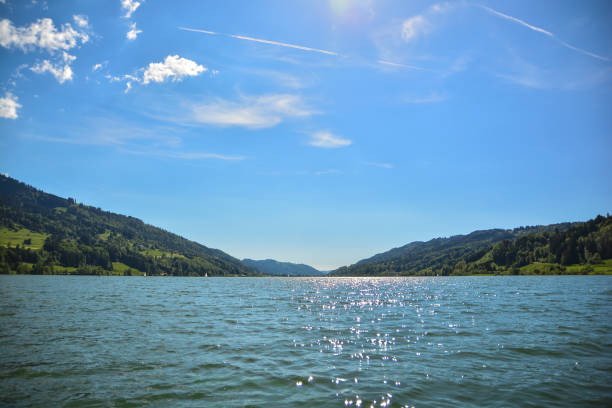 istock Summer Sun Lake Mountains with Sea Hills 1384364388