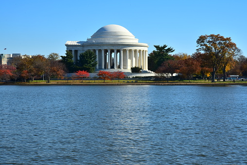 The Jefferson Memorial is reflected in the Tidal Basin as seen from the west on a clear autumn day, Washington, D. C.