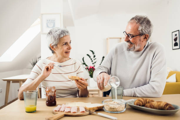 istock Happy seniors eating their healthy breakfast 1384369362