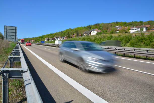 istock Motorway fast driving cars highway swoosh blurred 1384375331