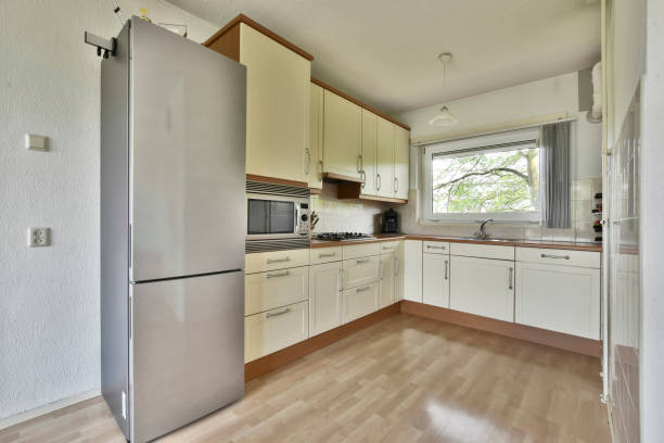 istock Compact kitchen with beige furniture 1384378748