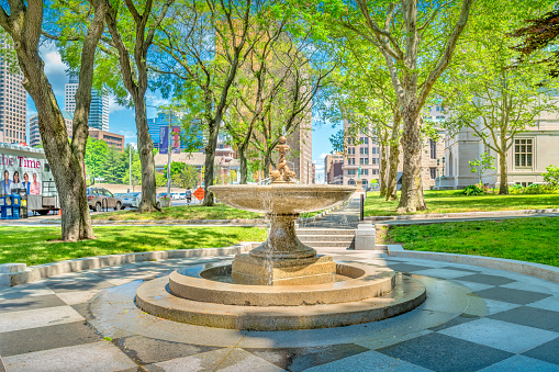 Small fountain at the city hall in downtown Hartford, Connecticut, USA on a sunny day.