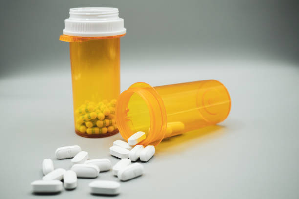 istock Two Prescription Bottles with Large White Pills 1384414199
