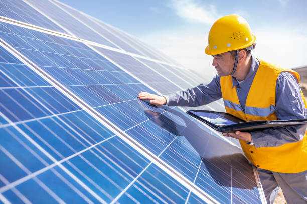 istock Asian middle-aged male power engineer is working at solar power station 1384419476