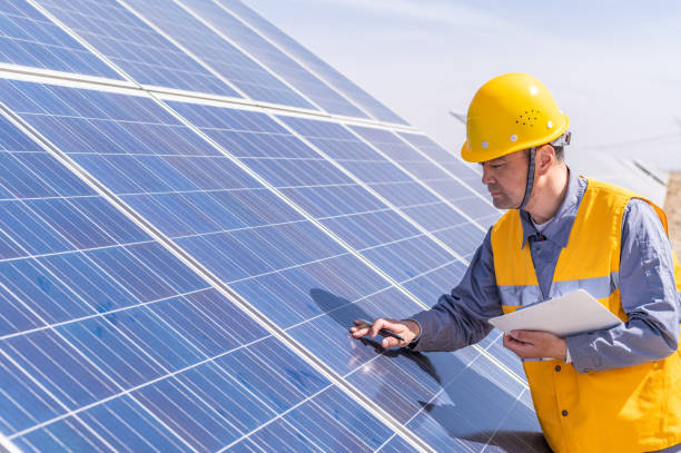 istock Asian middle-aged male power engineer is working at solar power station 1384419546