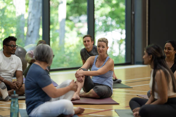 istock Adults on Break in a Fitness Class 1384422454