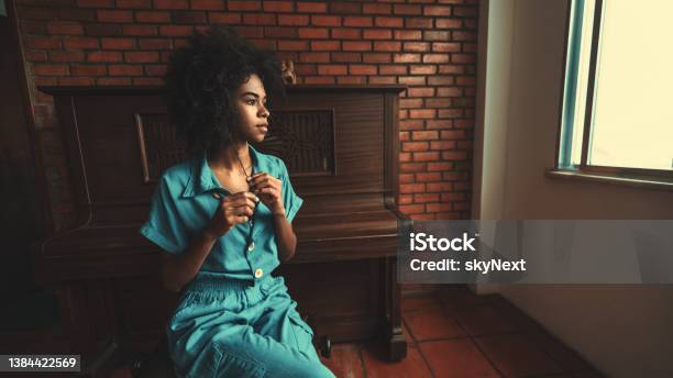 Thoughtful Black Girl Next To Piano Stock Photo - Download Image Now - People, Piano, Introspection