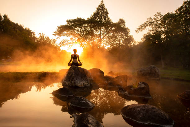 istock woman yoga practice performance in nature 1384425205