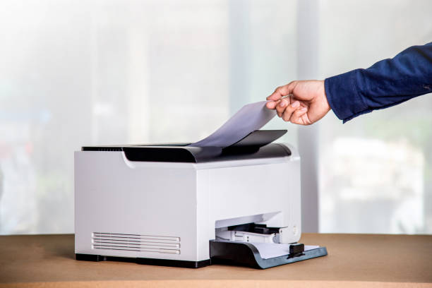 istock Printer, copier, scanner in office. Workplace ,photocopier machine for scanning document printing a sheet paper and xerox photocopy. 1384425237