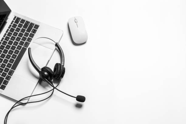 istock Headset and customer support equipment at call center ready for actively service , Communication support, call center and customer service help desk.for (call center) concept . 1384425261