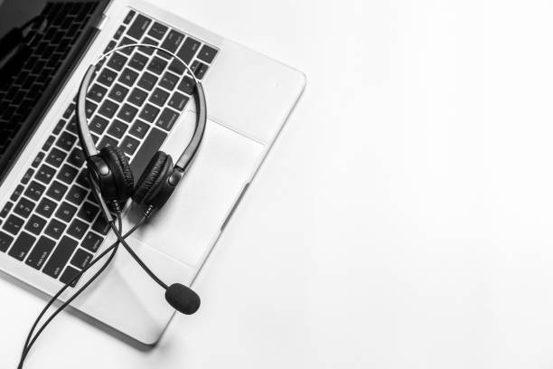 istock Headset and customer support equipment at call center ready for actively service , Communication support, call center and customer service help desk.for (call center) concept . 1384425263