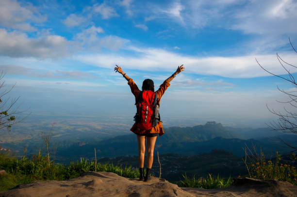 istock Hiker with backpack relaxing young woman hiking holiday 1384433157