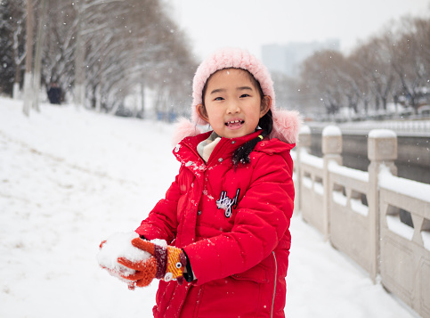 Little Girl Playing Snow