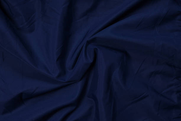 istock Blue fabric texture, background. folds close up. classic blue pantone 1384448591