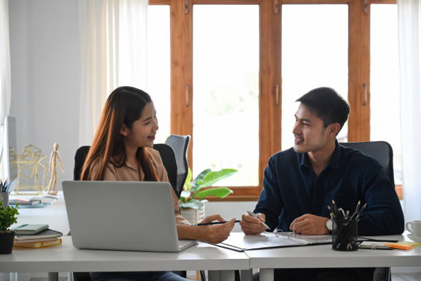 istock Two successful business partners discussing business plans or sharing ideas together. 1384456189