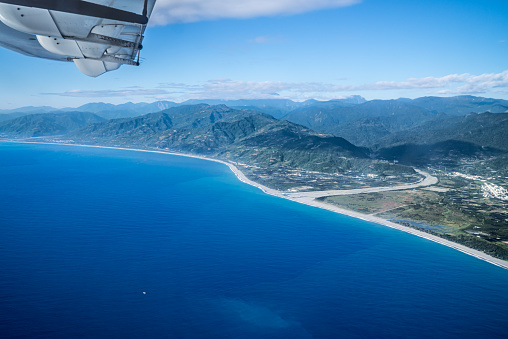 View the coastline from an airplane.
