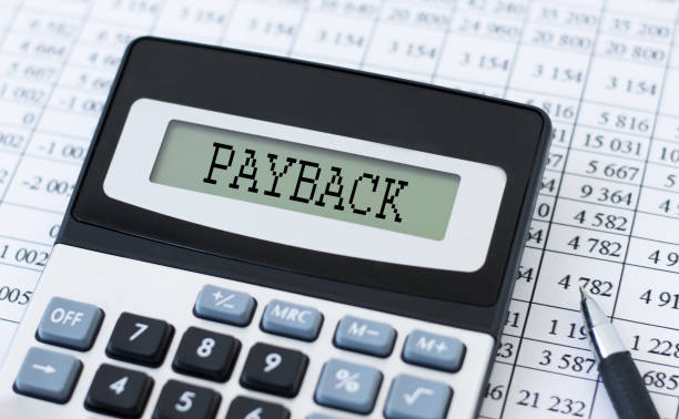 istock PAYBACK word on Calculator and pen on bank account documents 1384472740