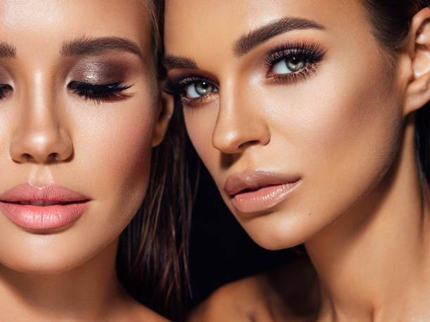 istock Two beautiful emotional women with perfect make-up 1384472909