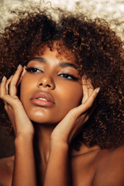 istock Beautiful girl with curly hairstyle 1384475175