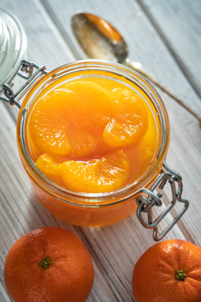 istock Canned tangerine. Pickled mandarin fruit. 1384477168