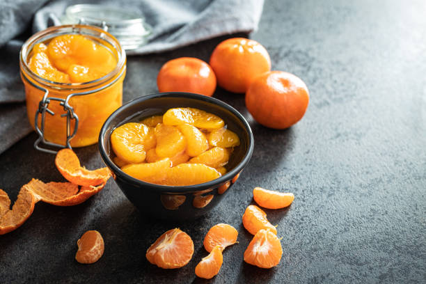 istock Canned tangerine. Pickled mandarin fruit. 1384477182