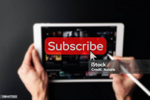 Subscription Plan Red Online Video Subscribe Button Internet Service On Laptop Digital Tablet Blured Technology Background Visual Contents Concept Social Networking Service Stock Photo - Download Image Now