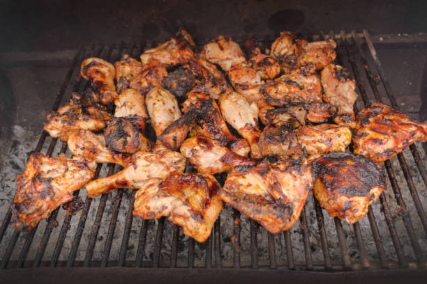 istock Grilling chicken wings and legs. BBQ, picnic, relaxation 1384480688