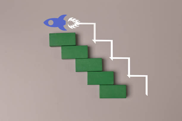 istock Wooden cube blocks with launching rocket. Business start up, new idea and new project concept. 1384488749