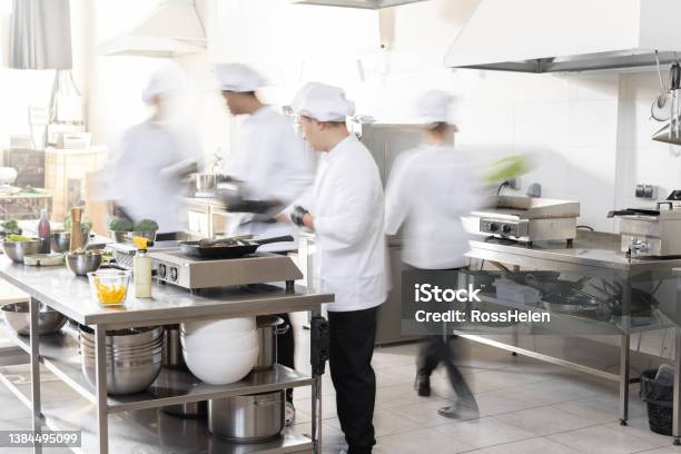 Chef Cooks Working In Professional Kitchen Stock Photo - Download Image Now - Kitchen, Chef, Restaurant