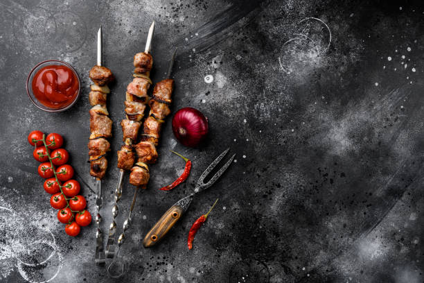 istock Grilled kebab, on black dark stone table background, top view flat lay, with copy space for text 1384503500