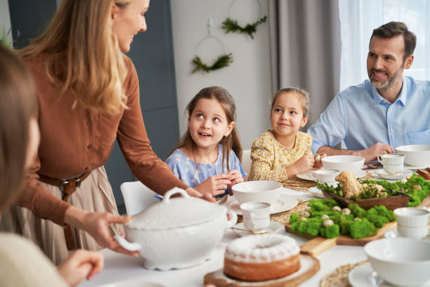 istock Caucasian family about to start an easter dinner at home 1384518831