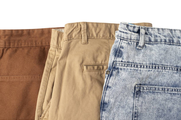 istock Blue jeans and brown pants close up. 1384520917