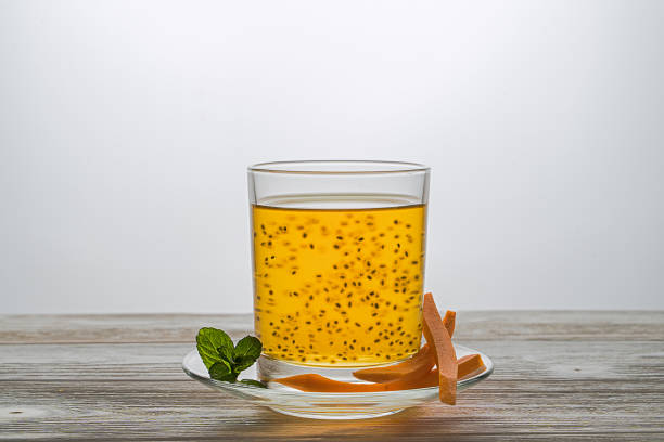 Carrot drink with basil seeds and mint. Useful antioxidant. In a glass jar stock photo