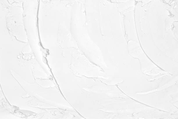 istock Smears of white plaster texture. Putty strokes pattern. Abstract light background 1384527372
