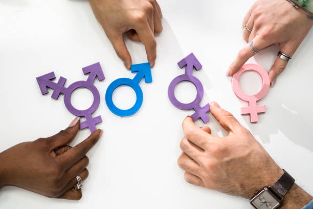 istock People Holding Different Type Of Gender Sign 1384530141