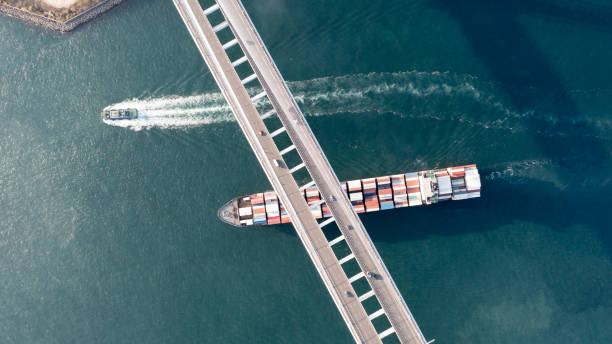 istock Container ship passes under Stonecutters Bridge,Hong Kong 1384533531