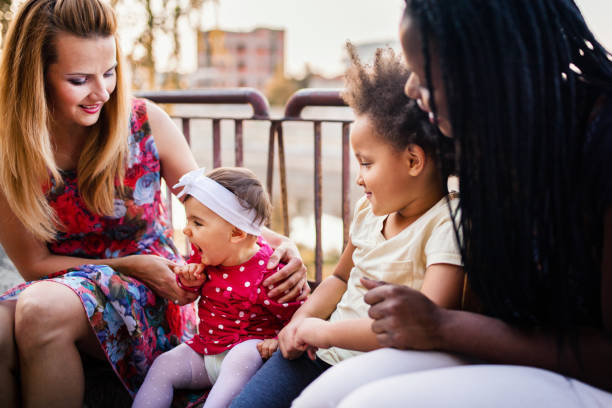 istock Multi ethnic female friends with kids 1384533684