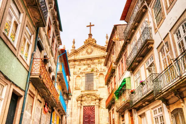 Photo of Typical City of Porto Street with Sao Bento Da Vitoria Church in the Background