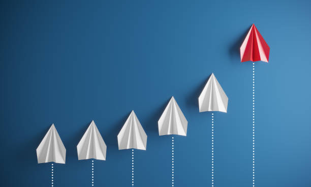 istock Leadership concept with paper airplanes 1384536416