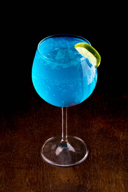 istock Blue curacao drink over a woody table 1384536586