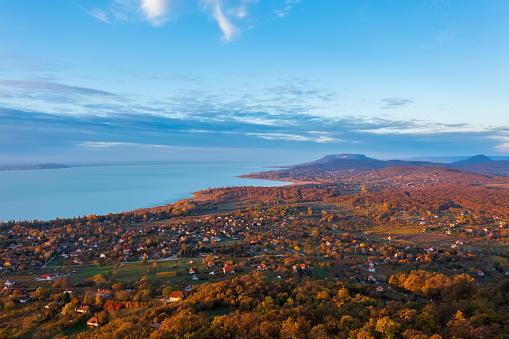 Aerial panoramic view about Révfülöp and Balaton Uplands with Badacsony at the background. Autumn morning landscape.