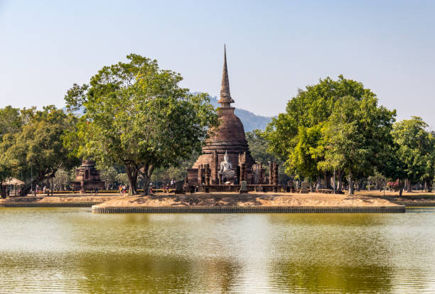 istock Lake and temple at Sukhothai 1384541709