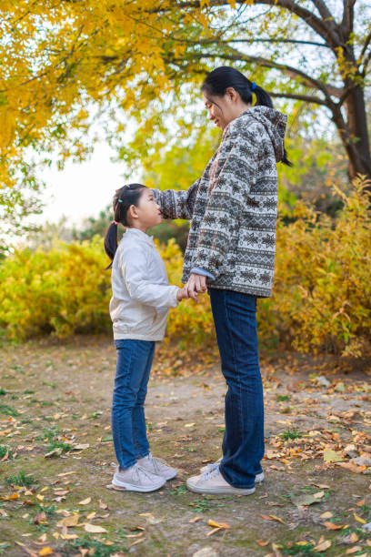 istock Mother and Daughter in Autumn 1384545571