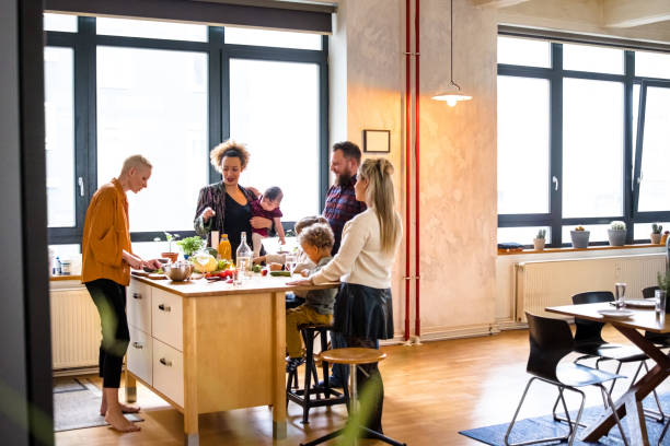istock Woman talking with friends while cooking dinner in kitchen 1384548560
